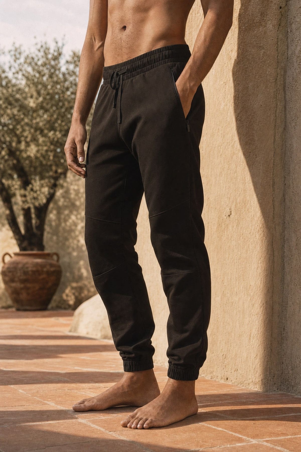 Joggers in ink, worn outdoors in warm afternoon light