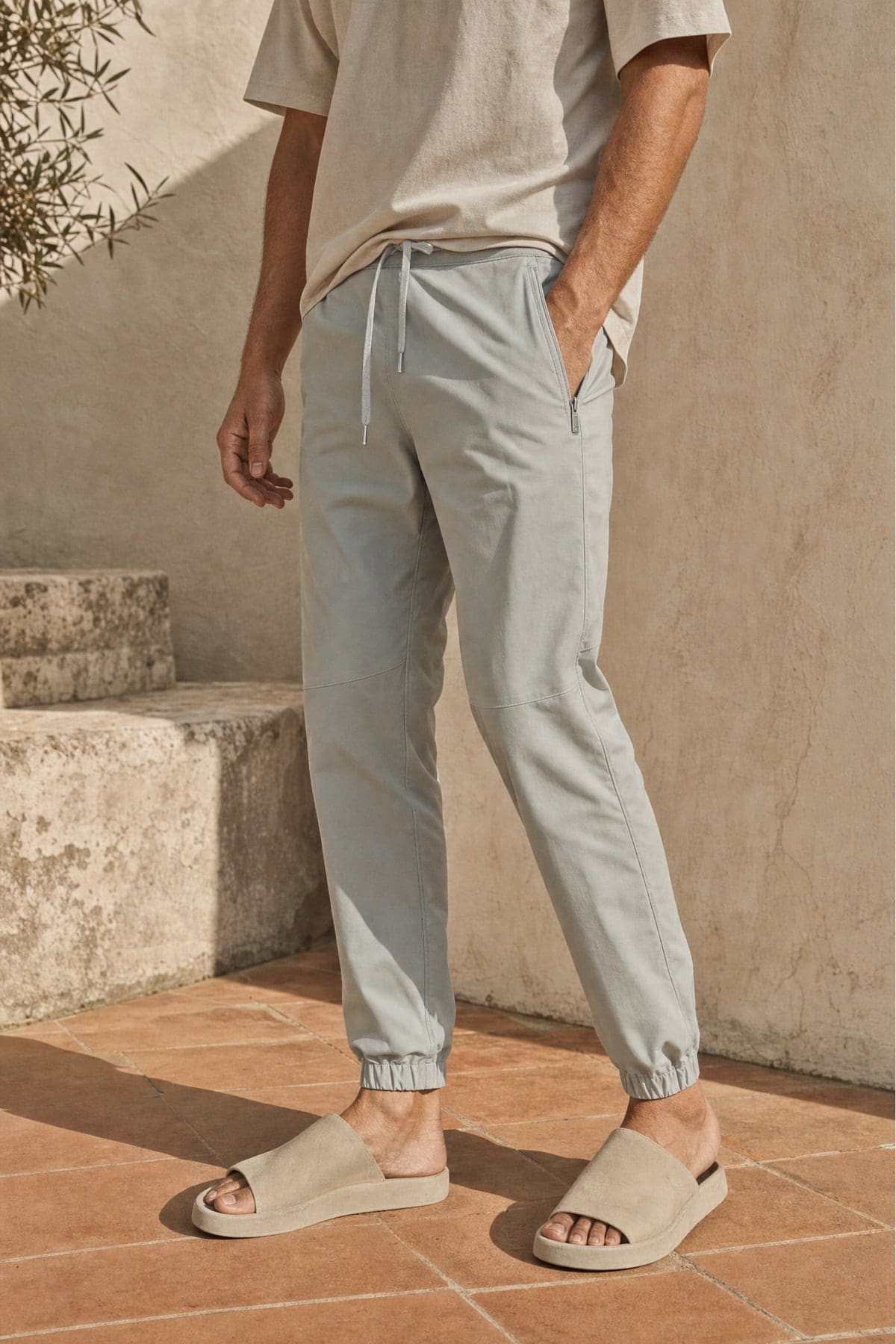Joggers in mist, worn outdoors in warm afternoon light