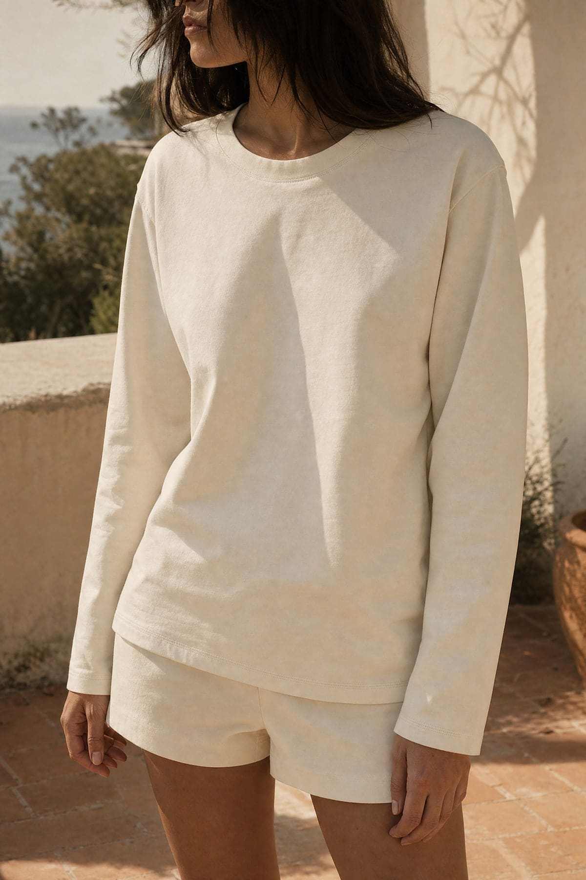 Long-sleeve in ecru, worn outdoors in warm afternoon light