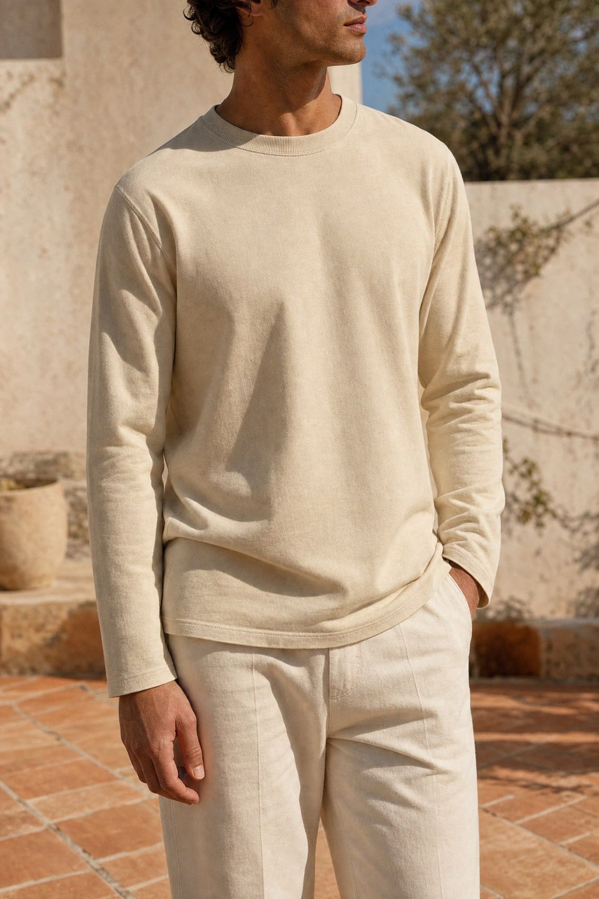 Long-sleeve in sand, worn outdoors in warm afternoon light