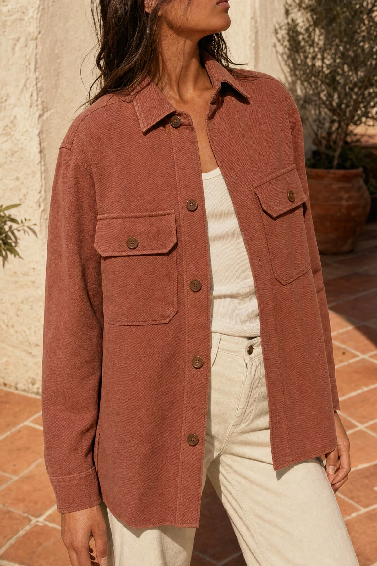 Overshirt in clay, worn outdoors in warm afternoon light