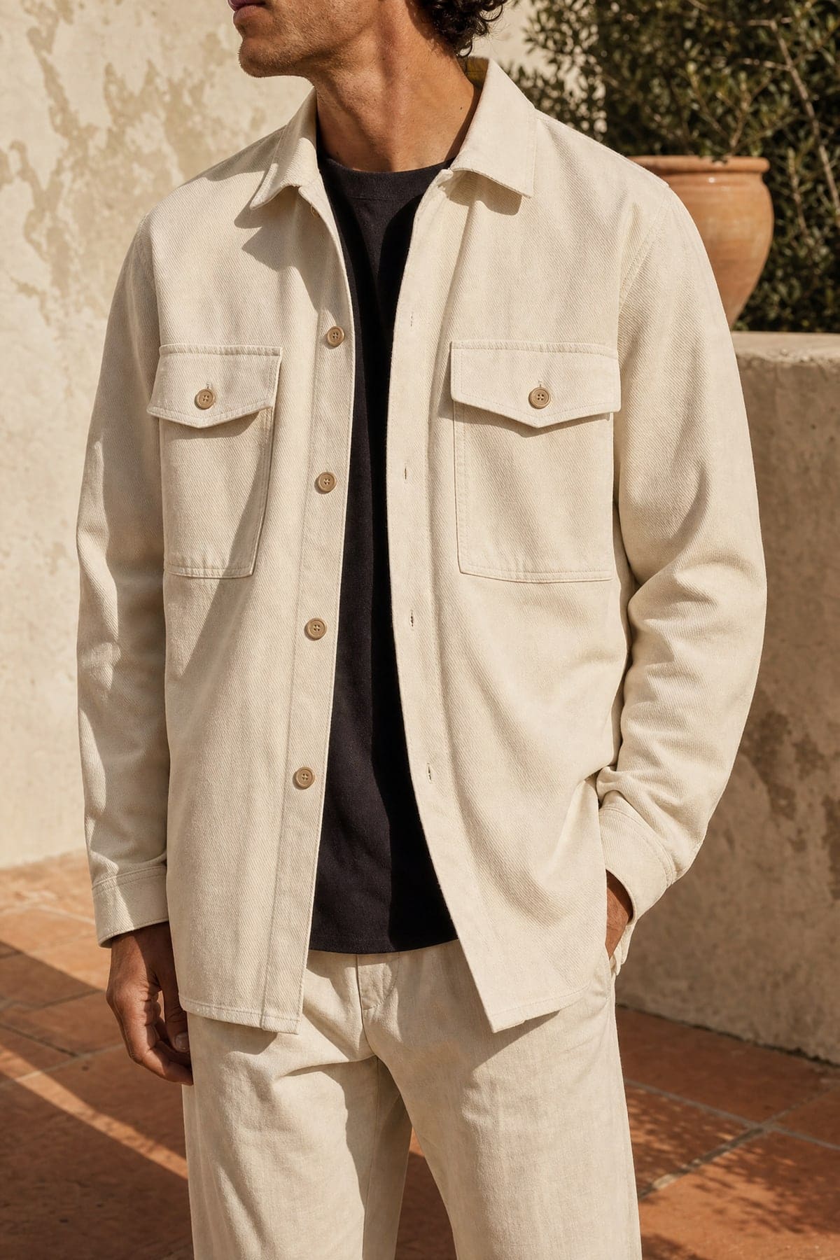 Overshirt in ecru, worn outdoors in warm afternoon light