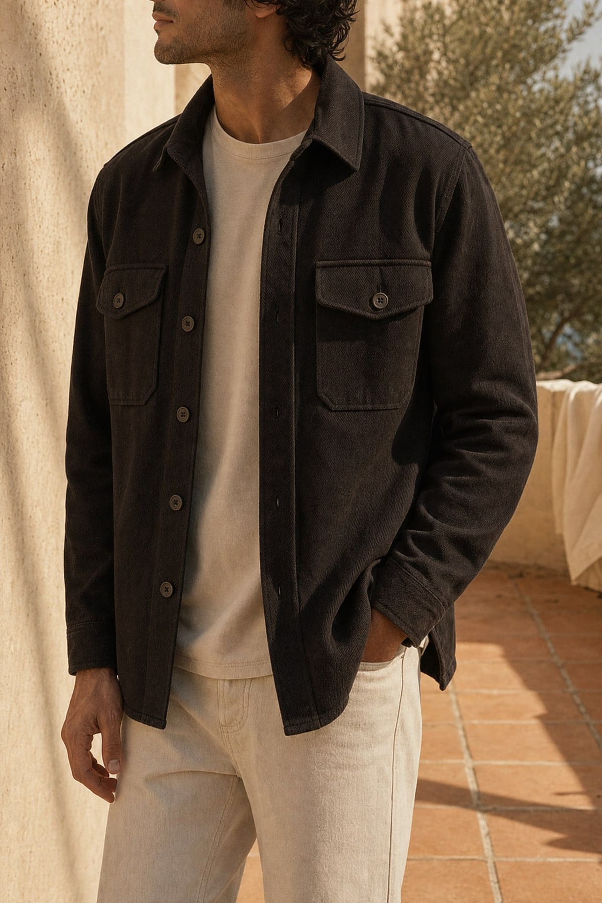 Overshirt in ink, worn outdoors in warm afternoon light