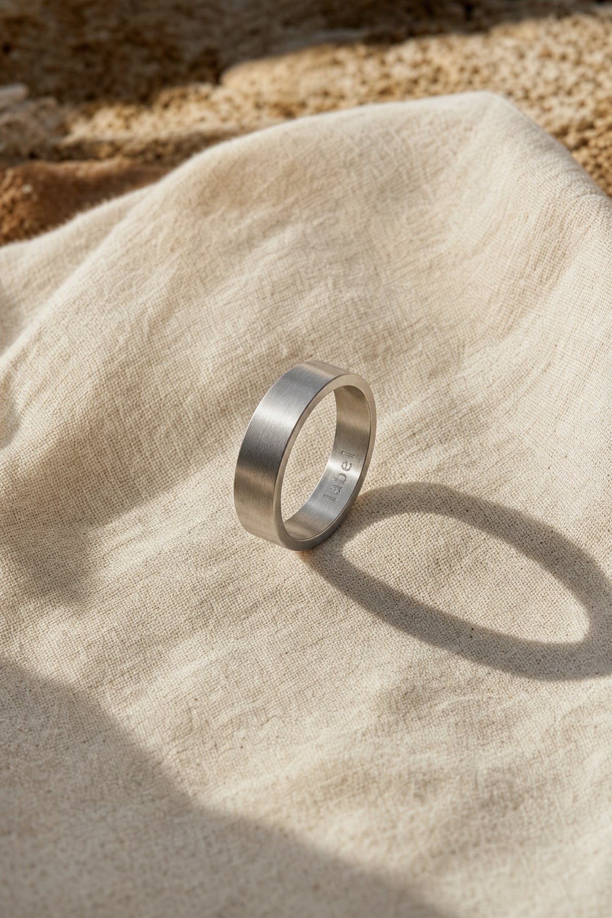 Ring in steel, in warm afternoon light