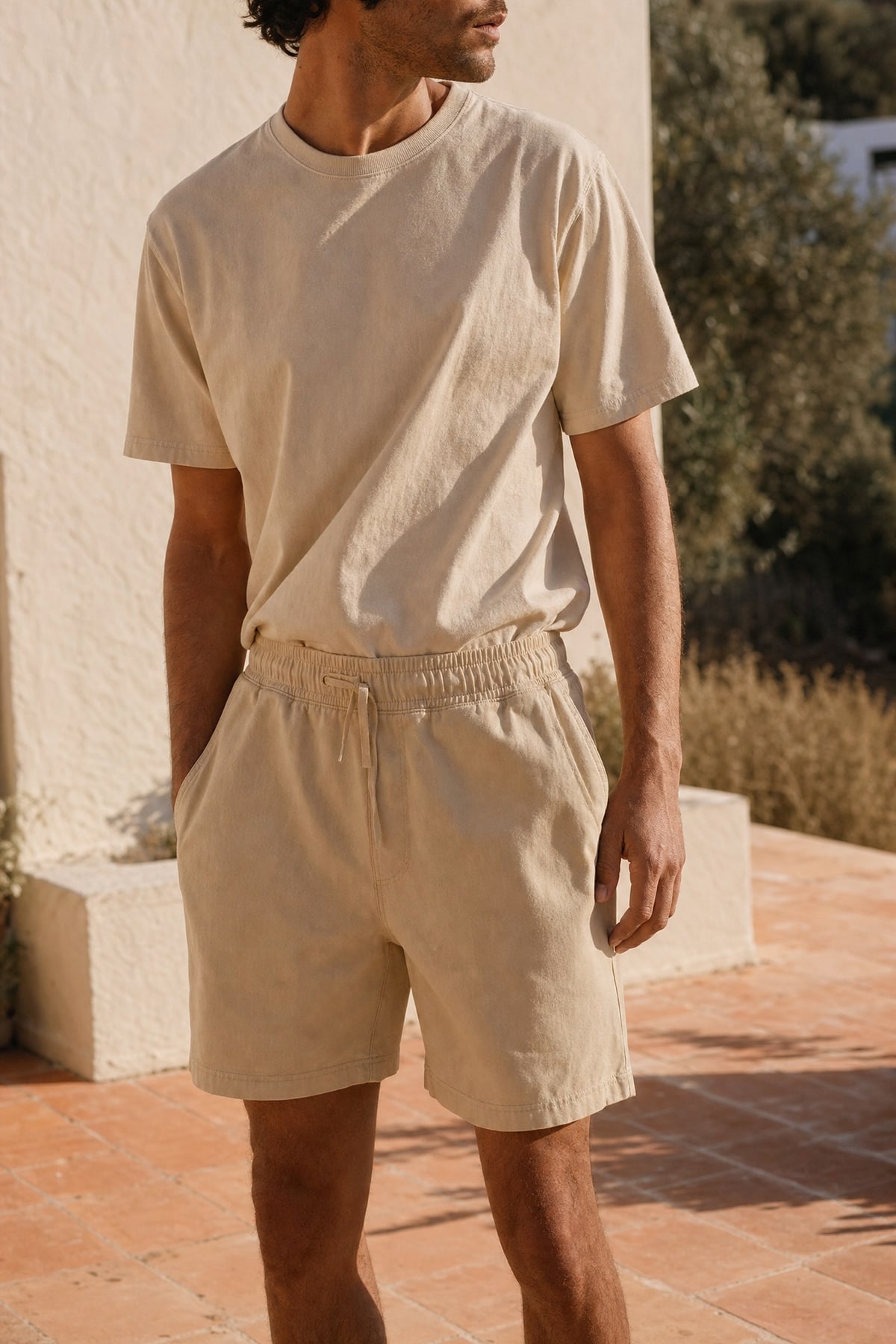 Shorts in stone, worn outdoors in warm afternoon light