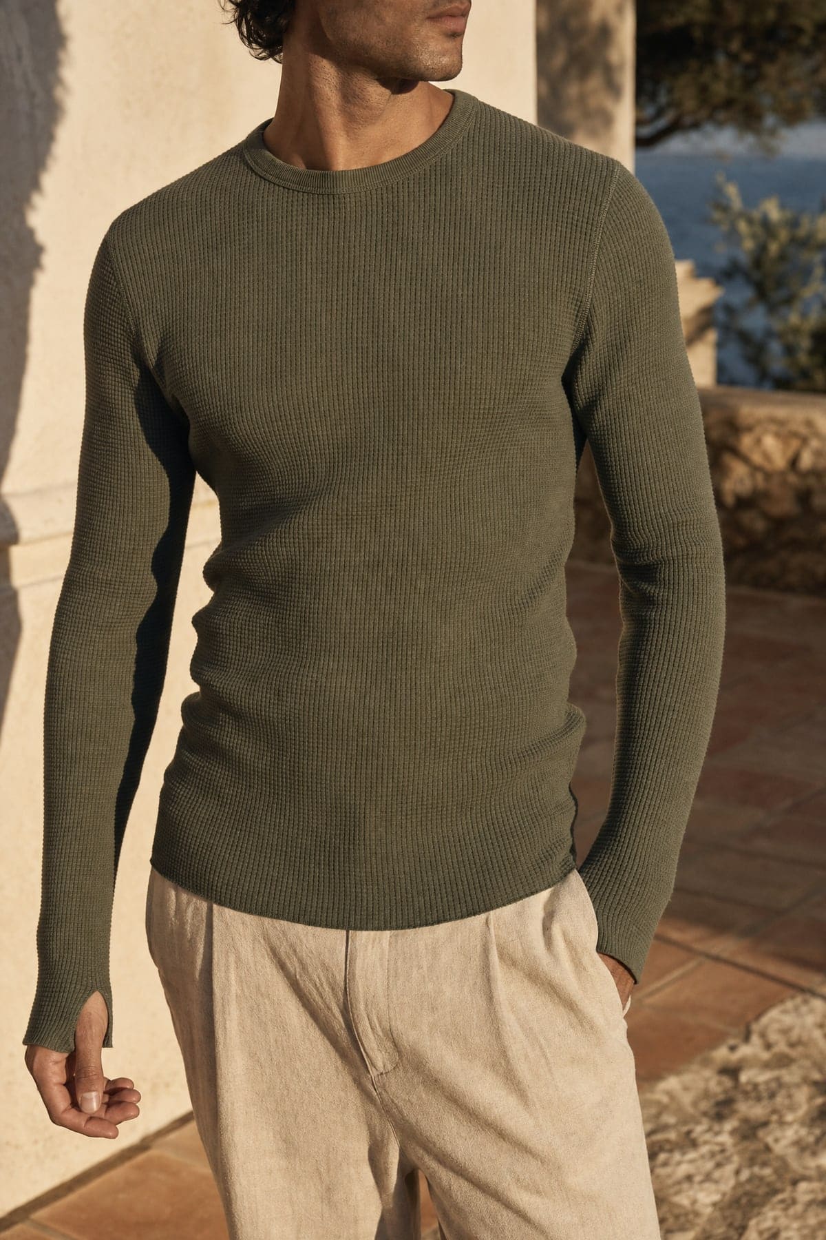 Thermal in olive, worn outdoors in warm afternoon light
