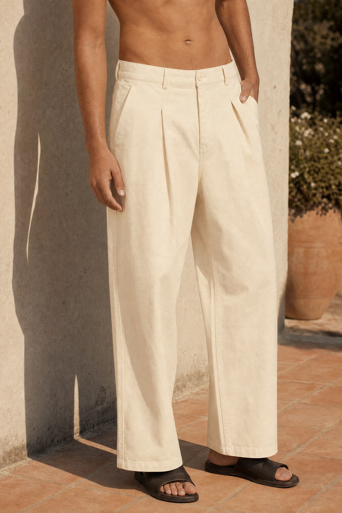Wide pants in ecru, worn outdoors in warm afternoon light