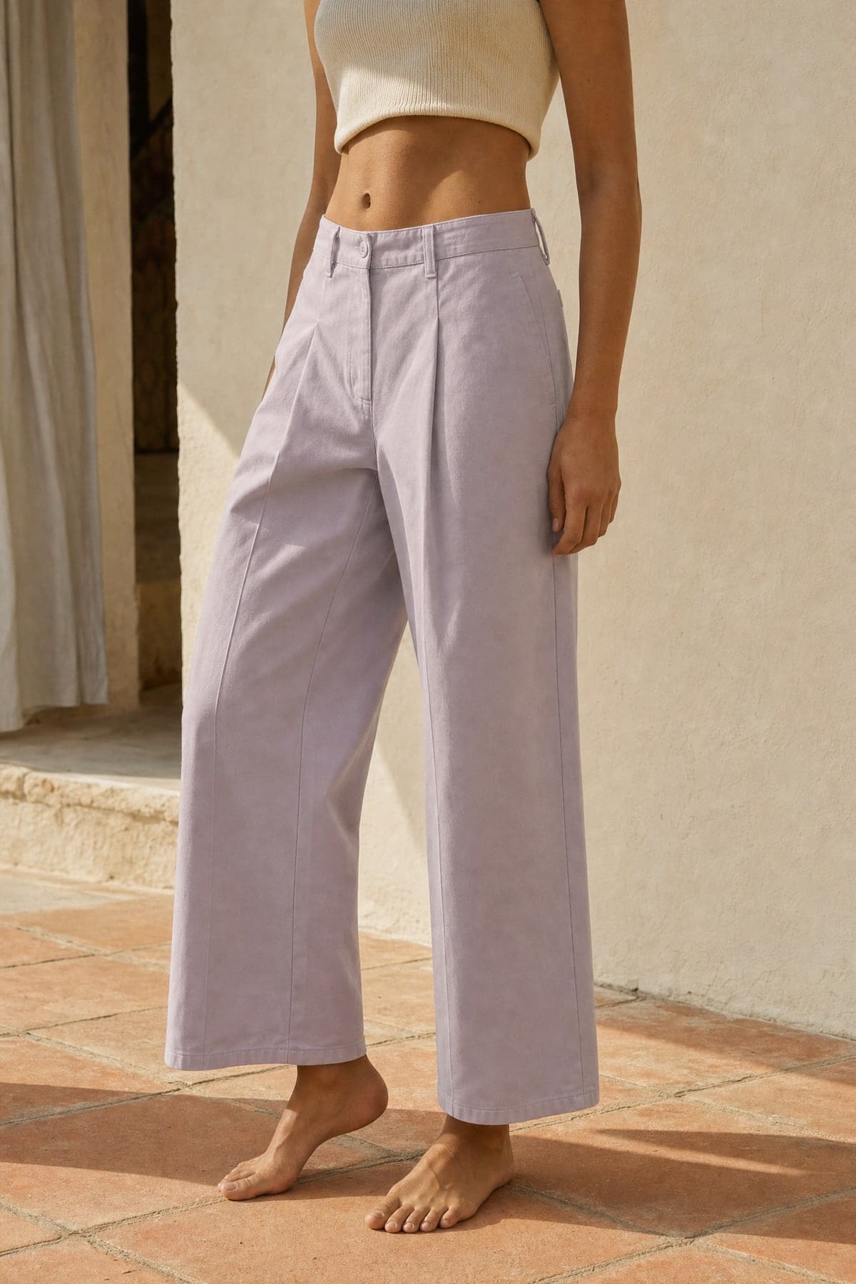 Wide pants in lilac, worn outdoors in warm afternoon light